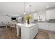 Eat-in kitchen with stainless steel appliances and an island overlooking the living room at 537 Garnet Dr, Acworth, GA 30101