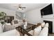 Bright living room with neutral decor, a fireplace, and comfortable sofas at 537 Garnet Dr, Acworth, GA 30101