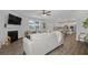 Bright open living room with fireplace, ceiling fan, and hardwood floors at 537 Garnet Dr, Acworth, GA 30101
