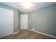 Bedroom features wood floors and two doors to provide easy access to other areas at 942 Village View Cir, Loganville, GA 30052