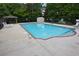 Community pool with lounge chairs, fencing, and a gazebo for relaxing by the poolside at 942 Village View Cir, Loganville, GA 30052