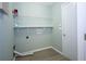 Compact laundry room with ample shelving and a clean, minimalist design at 942 Village View Cir, Loganville, GA 30052