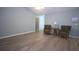 Bright living room showcasing hardwood floors, and two stylish armchairs at 942 Village View Cir, Loganville, GA 30052