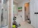 Bathroom featuring a soaking tub, separate shower, and neutral tile at 97 Coral Dr, Whitesburg, GA 30185