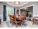 Formal dining room with natural light, elegant furniture, and classic design at 97 Coral Dr, Whitesburg, GA 30185