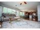 Open-concept living area featuring a comfortable seating area, dining space, and access to the kitchen at 97 Coral Dr, Whitesburg, GA 30185
