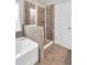 Bathroom featuring walk in shower, free standing tub, and private toilet at 10151 Benton Woods Dr, Covington, GA 30014