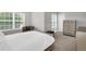 Bedroom with natural light, neutral paint, carpet, and luxury furniture set at 10151 Benton Woods Dr, Covington, GA 30014