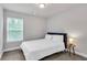 Bedroom with carpeted floors, natural light, neutral paint and simple furniture at 10151 Benton Woods Dr, Covington, GA 30014