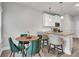 Cozy dining area featuring a round table with stylish chairs and modern pendant lighting at 10151 Benton Woods Dr, Covington, GA 30014