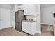 Modern kitchen featuring stainless steel appliances, white cabinets, and granite countertops at 10151 Benton Woods Dr, Covington, GA 30014