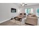 Cozy living room with neutral tones, a large window, and comfortable seating at 10151 Benton Woods Dr, Covington, GA 30014