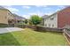Backyard featuring well-maintained grass, patio, and a wood fence at 29 Lankford Rd, Tucker, GA 30084