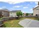 Spacious backyard with grass, concrete patio, and privacy fence at 29 Lankford Rd, Tucker, GA 30084