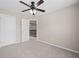 Bedroom featuring a ceiling fan, neutral walls, and carpeted floor at 29 Lankford Rd, Tucker, GA 30084