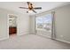 Bedroom with neutral walls, ceiling fan, and window with natural light at 29 Lankford Rd, Tucker, GA 30084