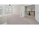 Expansive bonus room with soft carpet and plenty of natural light from the many windows at 29 Lankford Rd, Tucker, GA 30084