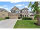 Charming two-story home featuring a brick and siding facade, well-manicured lawn, and an attached two-car garage at 29 Lankford Rd, Tucker, GA 30084
