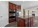 Gourmet kitchen showcasing a large island, stainless steel appliances, and ample cabinet space at 29 Lankford Rd, Tucker, GA 30084