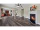 Spacious living room featuring a fireplace, hardwood floors, and seamless access to the kitchen at 29 Lankford Rd, Tucker, GA 30084