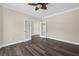 Spacious living room with neutral walls and dark, wood-look floors, offering a versatile design at 29 Lankford Rd, Tucker, GA 30084