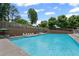 Outdoor community pool with lounge chairs and umbrellas at 29 Lankford Rd, Tucker, GA 30084