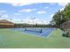 Community tennis courts with benches and lush surrounding trees at 29 Lankford Rd, Tucker, GA 30084