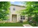 A backyard features a patio, lush green lawn, and partial shade from mature trees at 4076 Sonoma Wood Trl, Decatur, GA 30034