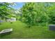 A serene backyard featuring a lush lawn and privacy trees perfect for relaxation at 4076 Sonoma Wood Trl, Decatur, GA 30034