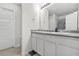 A well-lit bathroom featuring a double sink vanity, ample counter space, and modern fixtures at 4076 Sonoma Wood Trl, Decatur, GA 30034
