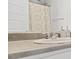 Close up of a bathroom sink and counter with a shower curtain visible at 4076 Sonoma Wood Trl, Decatur, GA 30034