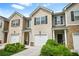 Charming townhomes featuring attached garages, brick accents, and well-maintained landscaping at 4076 Sonoma Wood Trl, Decatur, GA 30034