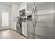 Bright kitchen features stainless steel appliances, granite countertops, and white cabinetry at 4076 Sonoma Wood Trl, Decatur, GA 30034