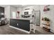Modern kitchen island with bar seating and stainless steel appliances at 4076 Sonoma Wood Trl, Decatur, GA 30034