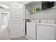 A convenient laundry area with appliances, shelving, and open access at 4076 Sonoma Wood Trl, Decatur, GA 30034