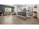 Open-concept living space with a modern kitchen, comfortable seating, and stylish decor at 4076 Sonoma Wood Trl, Decatur, GA 30034