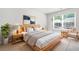 Bright bedroom with neutral decor, a large window, and natural wood furnishings at 4076 Sonoma Wood Trl, Decatur, GA 30034