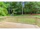 Back deck featuring wooden railing and wooded views at 803 Cedar Lake Se Dr, Conyers, GA 30094