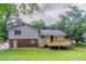 Exterior of house and new back deck showcasing the large grassy yard at 803 Cedar Lake Se Dr, Conyers, GA 30094