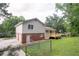 Exterior of home with new deck, finished garage, and fenced yard at 803 Cedar Lake Se Dr, Conyers, GA 30094