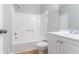 Bathroom featuring a shower-tub combo, vanity with a sink, and neutral-colored walls at 803 Cedar Lake Se Dr, Conyers, GA 30094