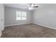 Large bedroom featuring a ceiling fan and lots of natural light from a window at 803 Cedar Lake Se Dr, Conyers, GA 30094