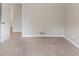 Neutral bedroom with carpeted floors and a door to an adjacent room at 803 Cedar Lake Se Dr, Conyers, GA 30094