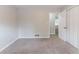 Clean bedroom with neutral paint, plush carpet, and ample closet space at 803 Cedar Lake Se Dr, Conyers, GA 30094