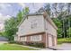 Two-story home with brick foundation, vinyl siding, and a convenient attached garage at 803 Cedar Lake Se Dr, Conyers, GA 30094
