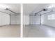 Spacious two car garage featuring two garage door openers and painted concrete floors at 803 Cedar Lake Se Dr, Conyers, GA 30094