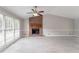 Bright living room features a brick fireplace, neutral walls, and ample natural light at 803 Cedar Lake Se Dr, Conyers, GA 30094