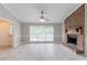 Spacious living room featuring a brick fireplace and large windows at 803 Cedar Lake Se Dr, Conyers, GA 30094