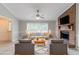 Staged living room with brick fireplace, plush seating, and abundant natural light at 803 Cedar Lake Se Dr, Conyers, GA 30094