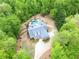 Aerial view of a secluded home showcasing lush greenery and a pristine backyard pool at 95 Weslyan Way, Oxford, GA 30054
